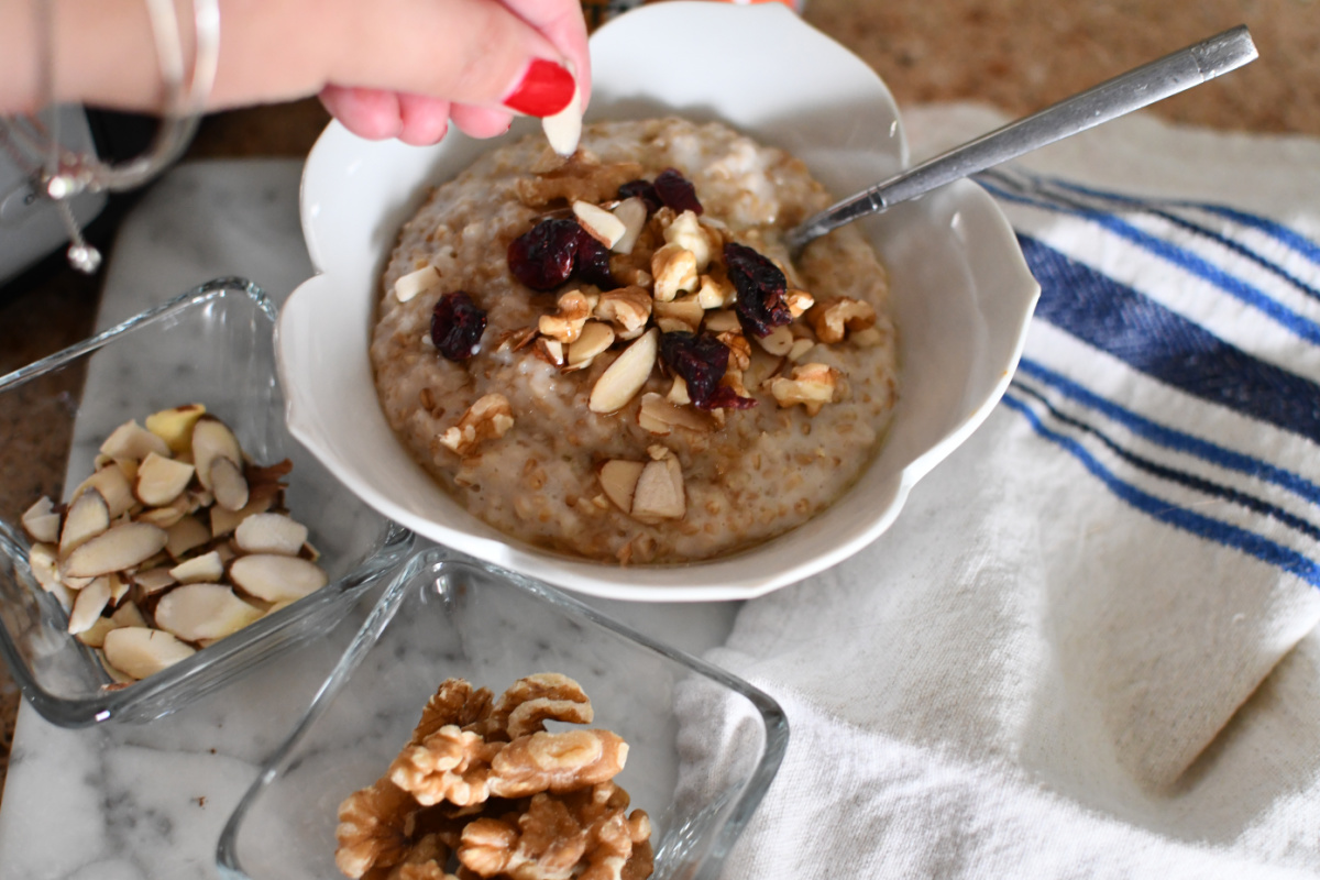 Placing sliced almonds on Crockpot oatmeal