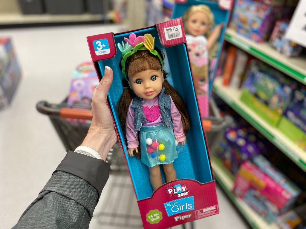 hand holding Play Zone Doll at Big Lots