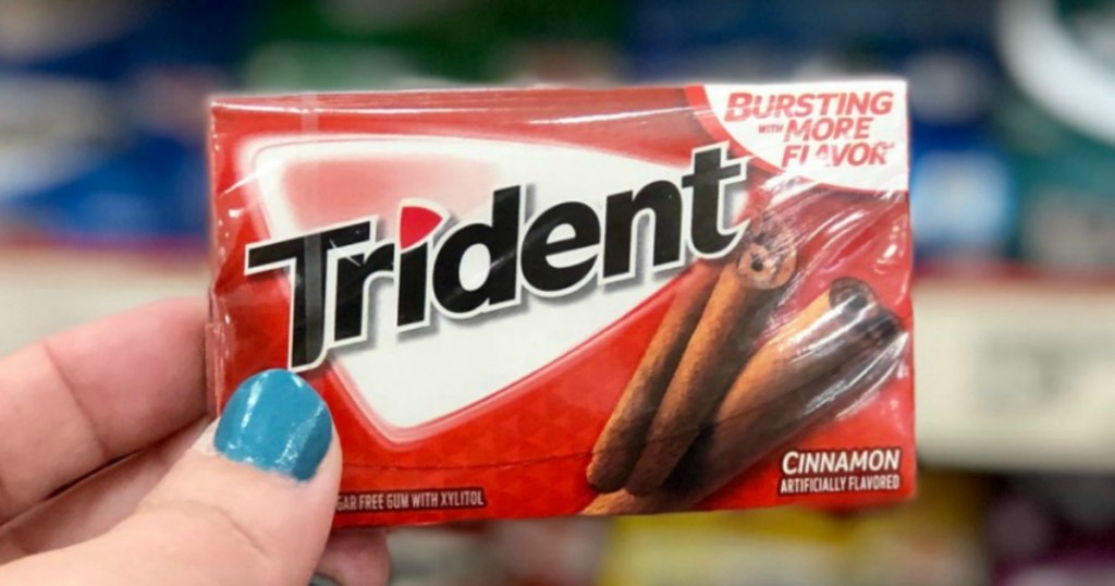 Cinnamon flavored gum in package in hand in-store