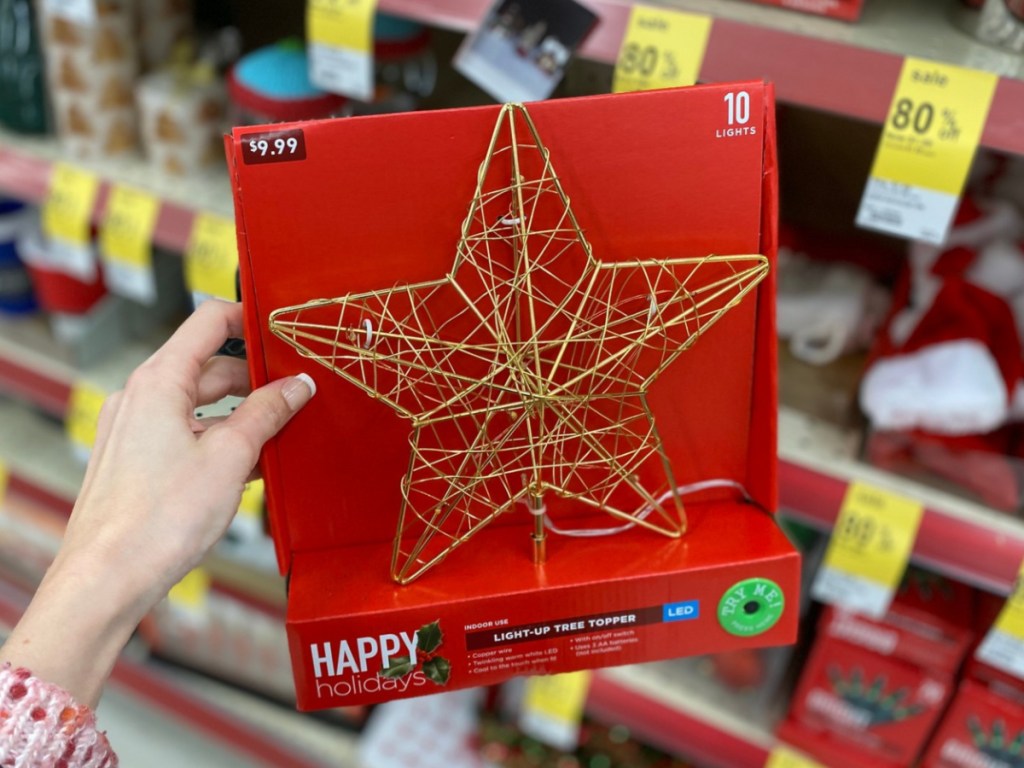 Hand holding Walgreens holiday tree topper