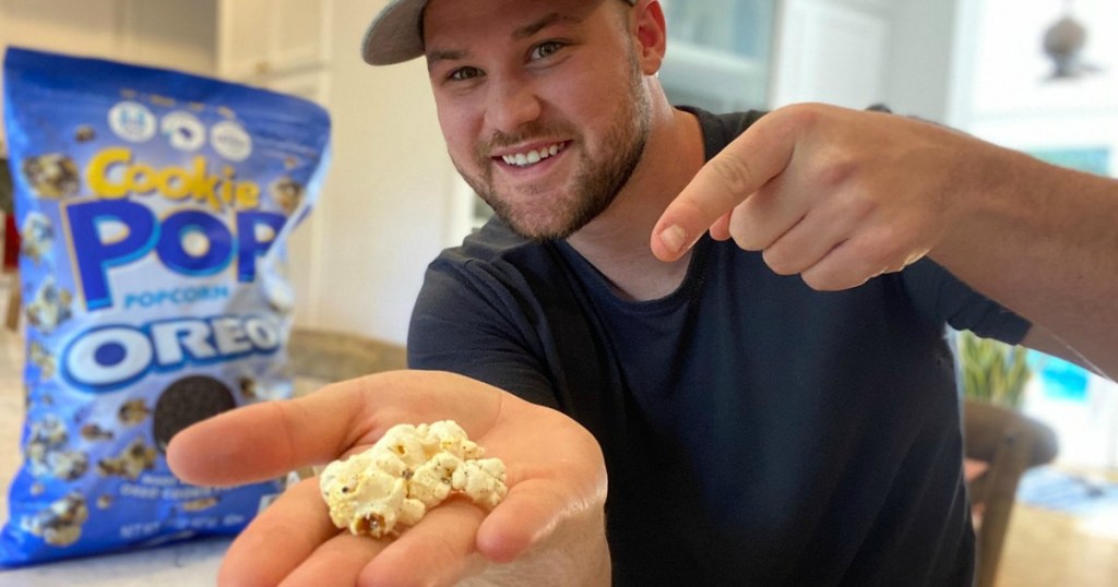 man holding cookie pop OREO