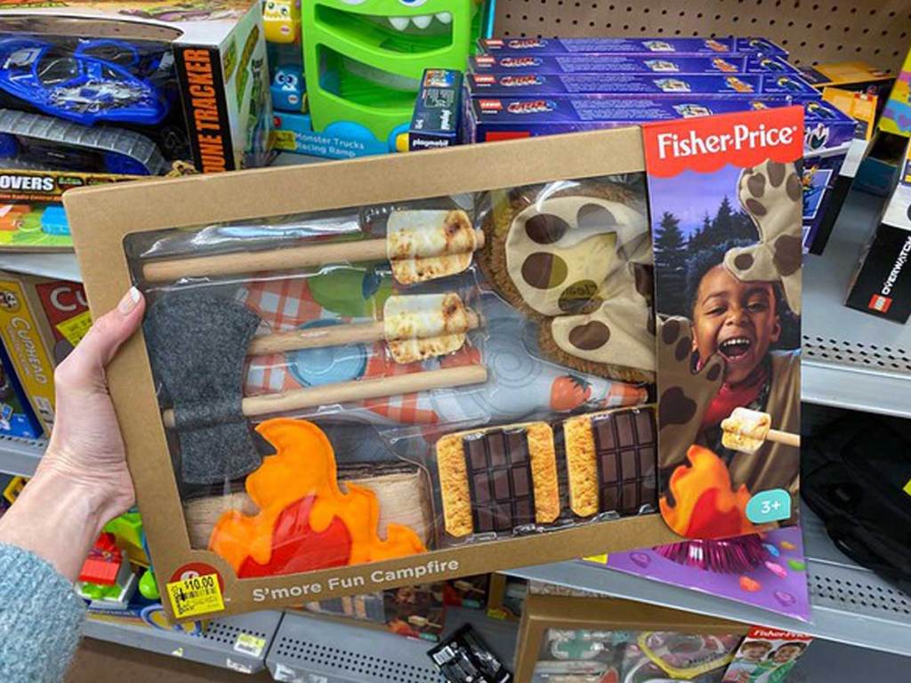 hand holding Fisher-Price S'more Fun Campfire in a store