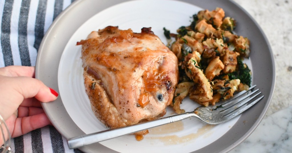 plate with savory peach roasted chicken and waffle stuffing 