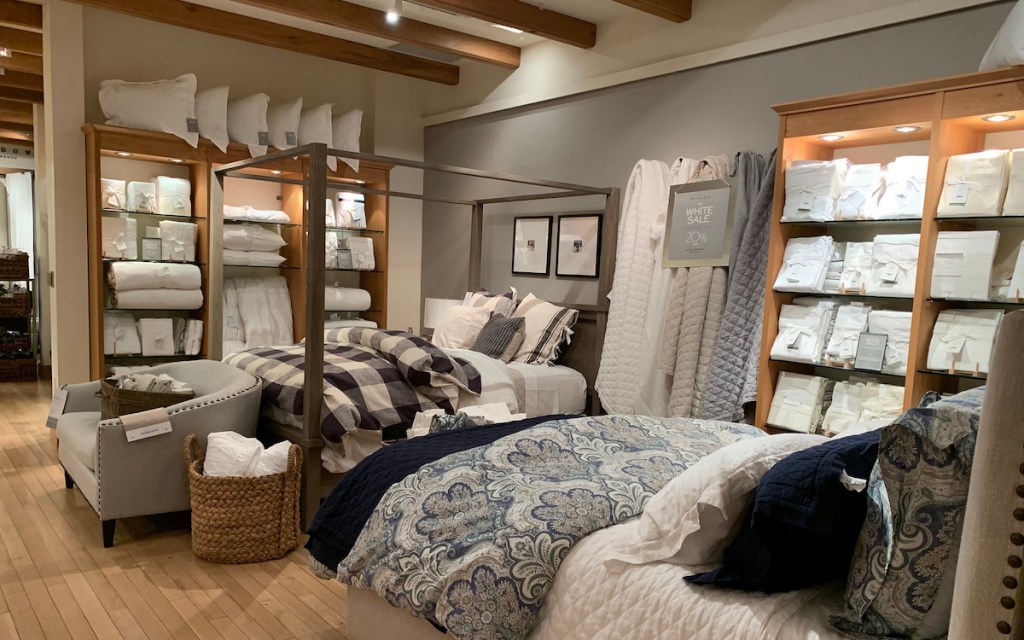 pottery barn store with beds and pillows