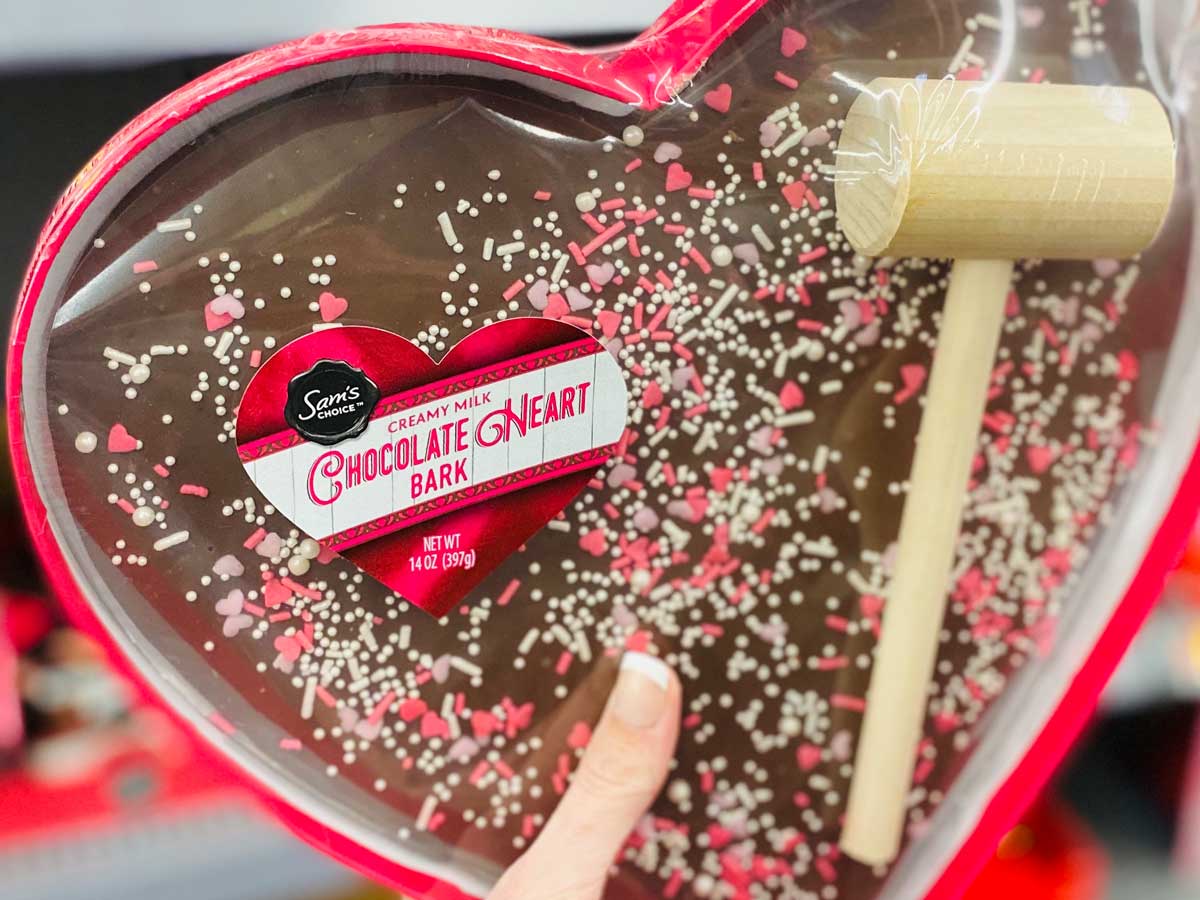heart-shaped chocolate bark with sprinkles and a mallet