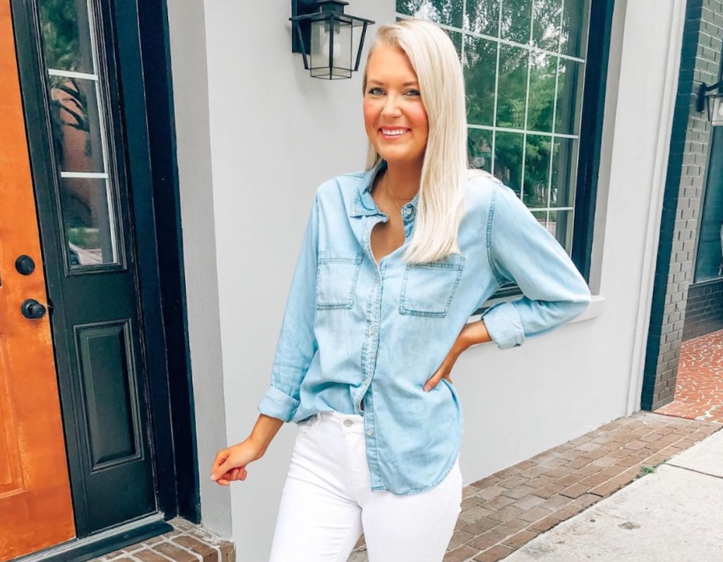 woman wearing chambray shirt and white pants outside