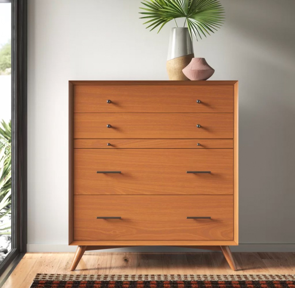 mid century modern wood dresser in styled room