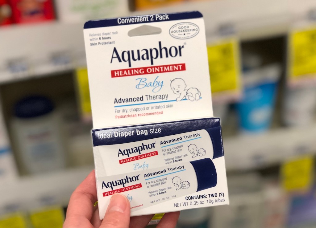 hand holding box of Aquaphor Baby Healing Ointments