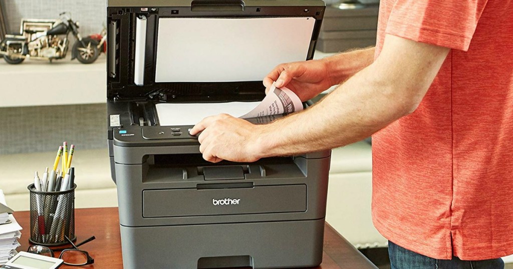 person copying something on a printer