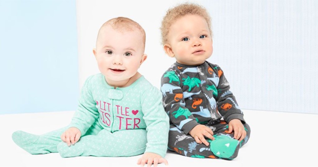 two babies wearing child of mine by carter's footed pajamas