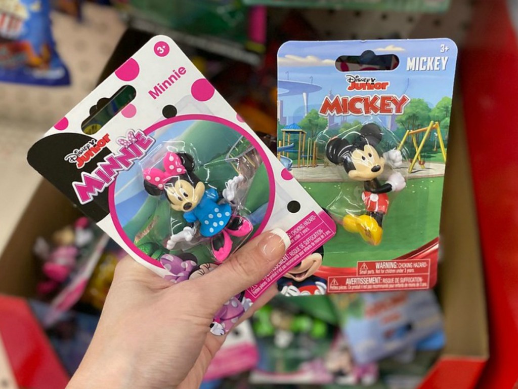 hand holding packages containing little Micky characters