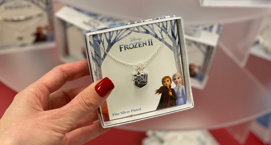 hand holding a jewelry box with a Frozen 2 Necklace