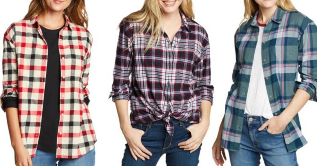 Three women wearing flannel shirts