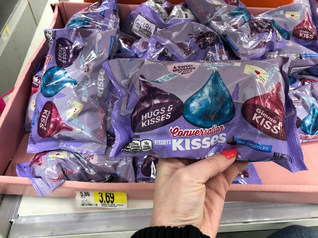 hand holding bag of Hershey's Conversation Kisses