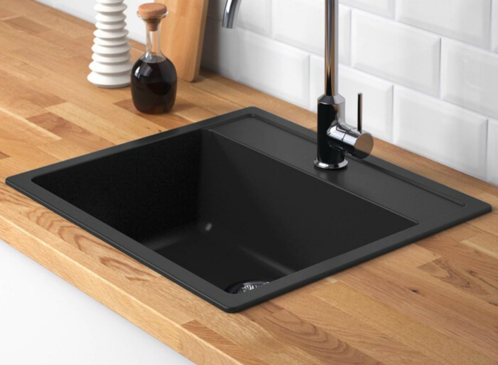 Black sink from IKEA with faucet and wooden counter top