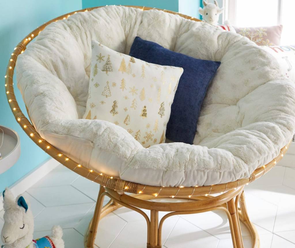 papasan chair with pillows in it