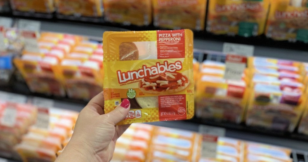 woman hand holding Pizza with Pepperoni Lunchable in target