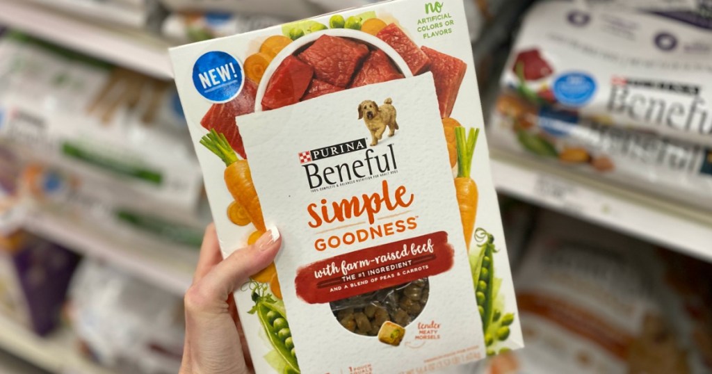 hand holding a box of Purina Beneful Simple Goodness dog food