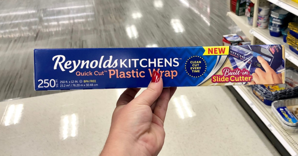 woman hand holding Reynolds kitchen plastic wrap