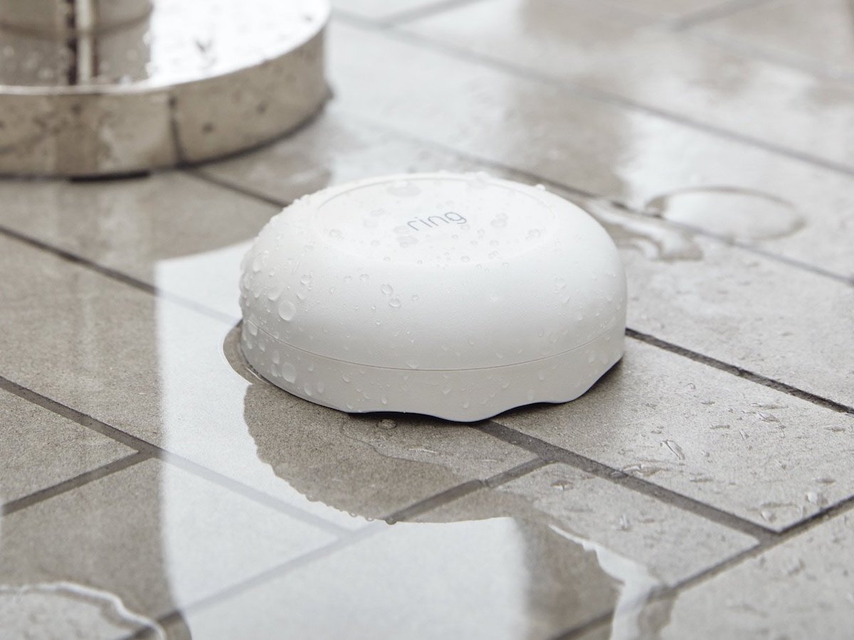 Ring Flood and Freeze Monitor on tile floor with water on it