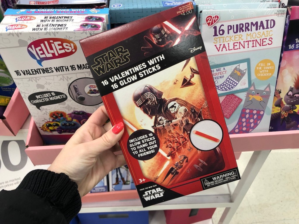 hand holding box of Star Wars valentines