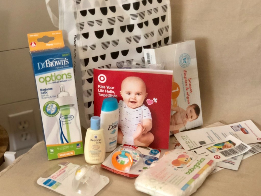 Target Baby Registry tote bag sitting on a chair with baby freebies