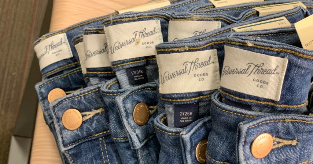 pairs of Universal Thread Jeans folded with tags showing