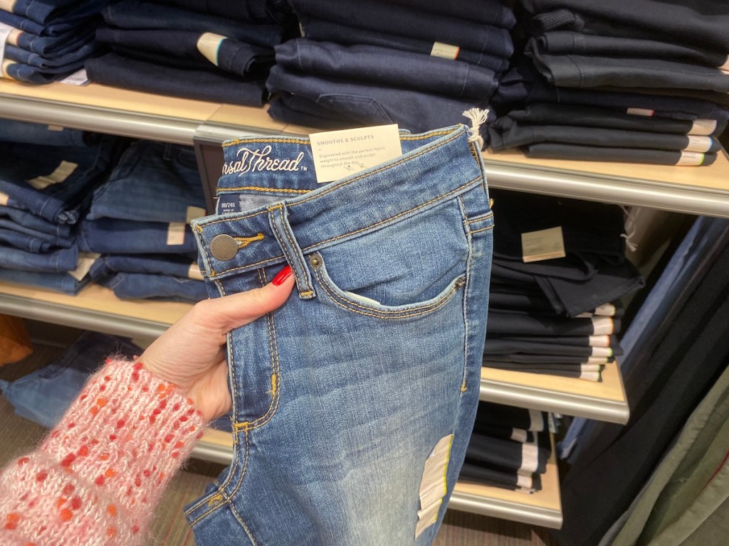 hand holding a pair of Universal Thread women's Jeans