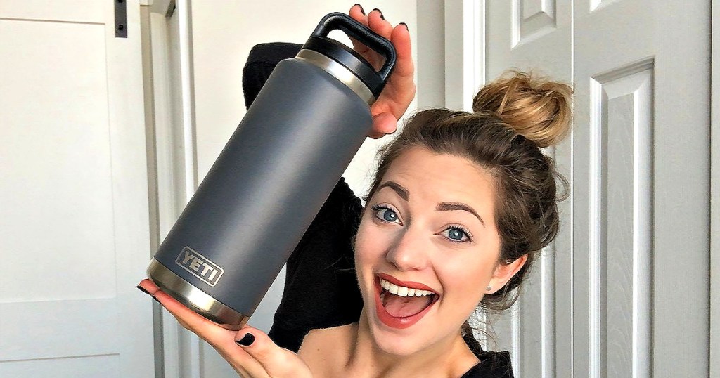 Woman holding grey Yeti Rambler Bottle