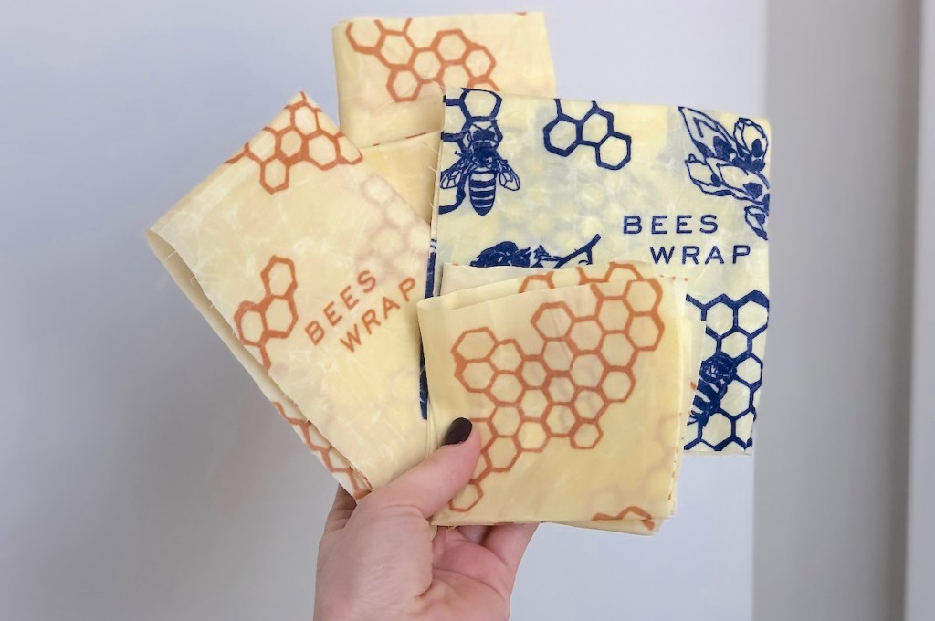 hand holding yellow and blue bees wraps