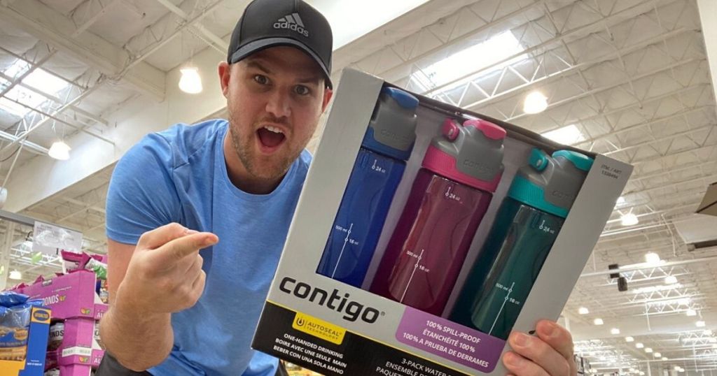 man holding and pointing at 3 pack of water bottles in store