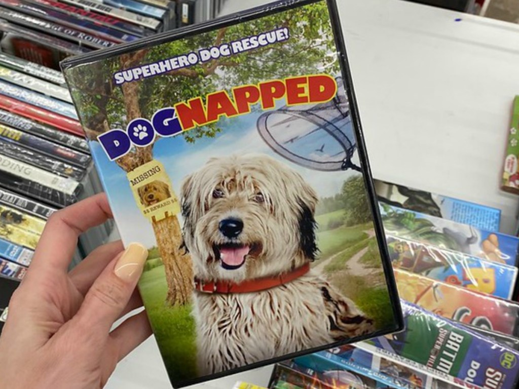 hand holding DVD with dog's face on it