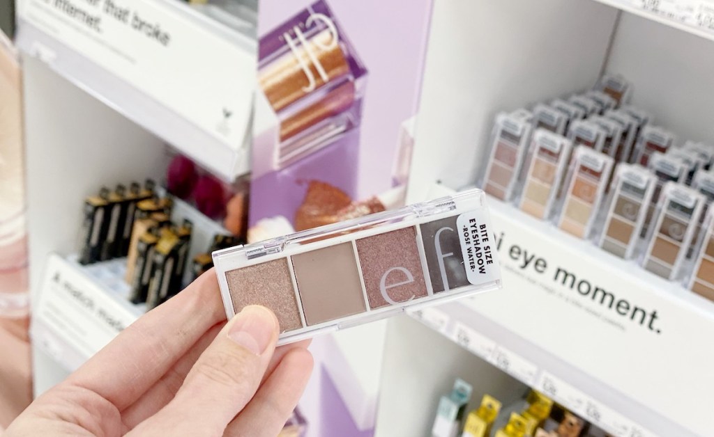 hand holding an eyeshadow pallet in store