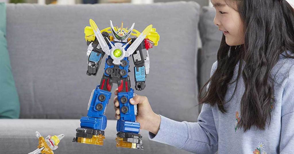 girl playing with power rangers ultrazord toy