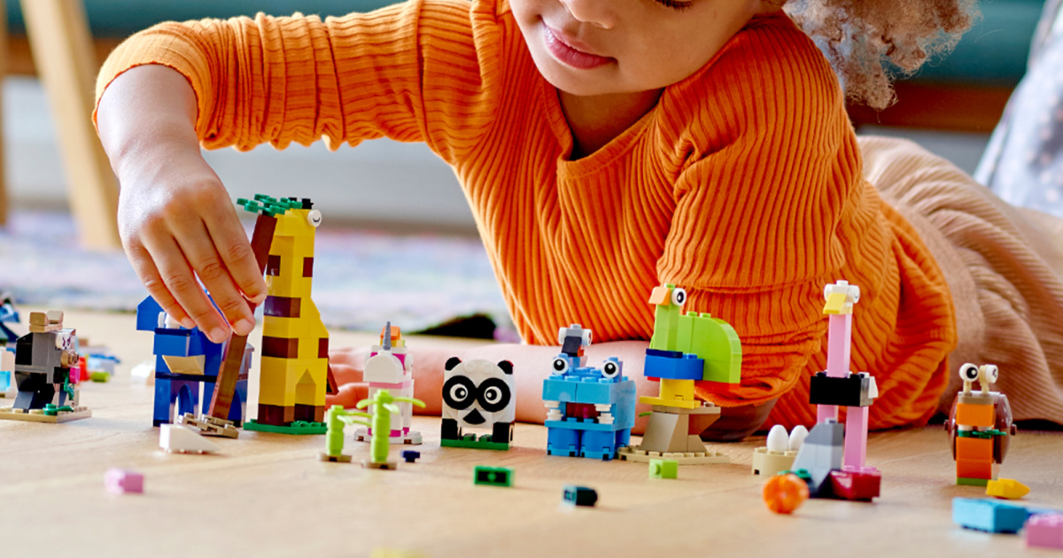 child playing with LEGOs