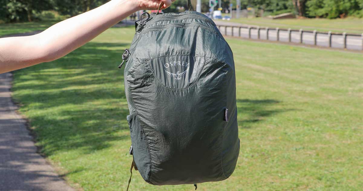 hand holding a backpack