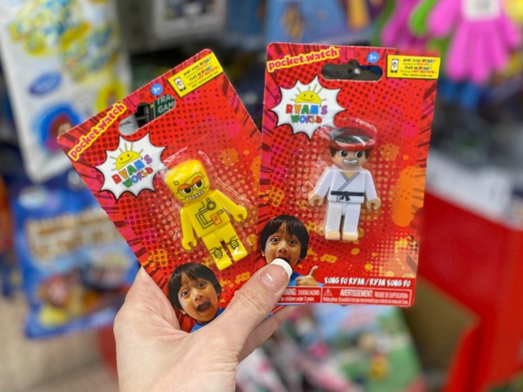 hand holding little packs with toys in them