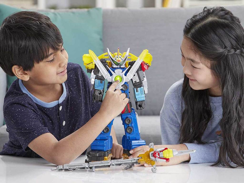 boy and girl playing with power rangers ultrazord toy