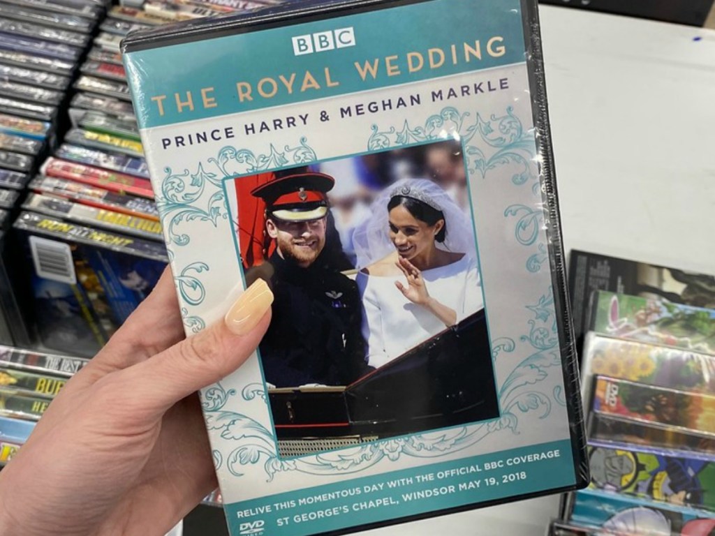 hand holding DVD with Royal Wedding by store display