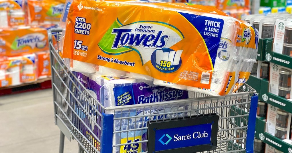 sams club cart with toilet paper and paper towel stacked inside