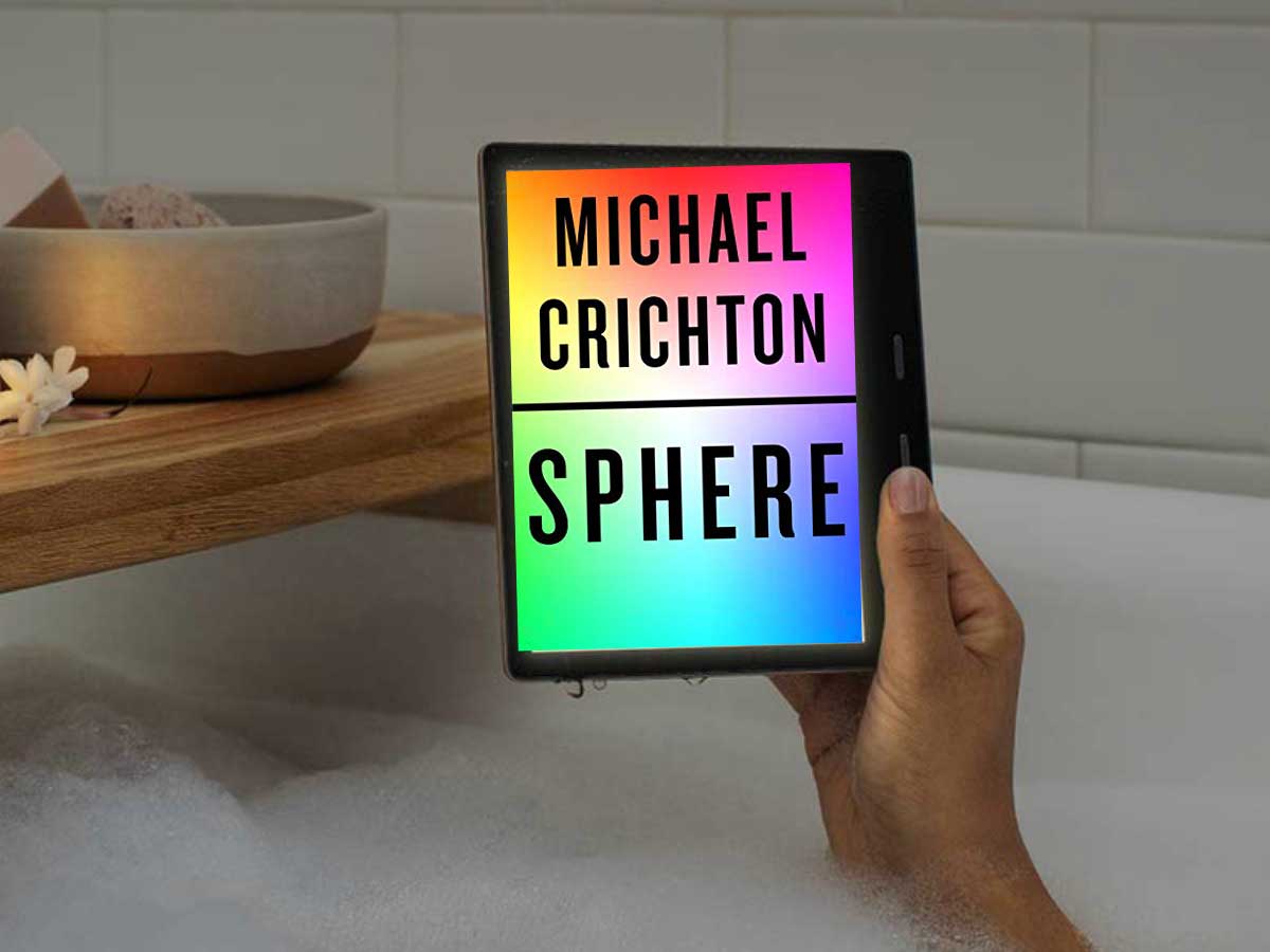 the book Sphere by Michael Crichton being held up in the bathtub