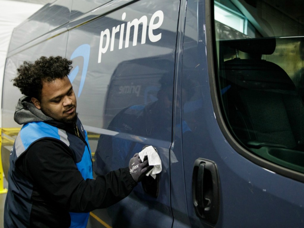 Worker cleaning Amazon Prime Van