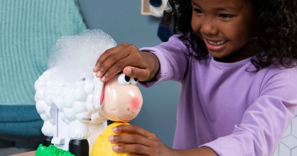 girl playing with baa baa bubbles game