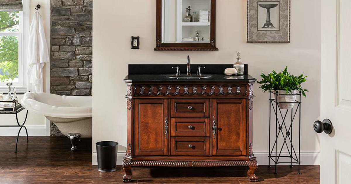 bathroom with wood vanity and a mirror