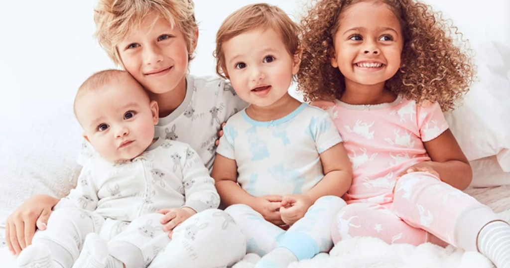 kids sitting together wearing pajamas