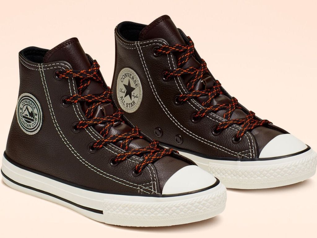 pair of leather converse kids sneakers