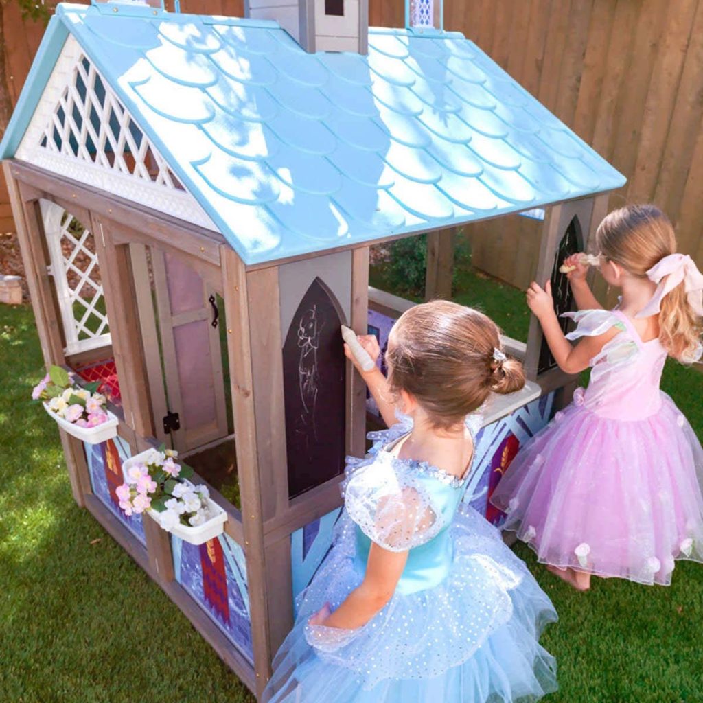 two girls using chalk on Disney’s Frozen 2 Arendelle Playhouse 