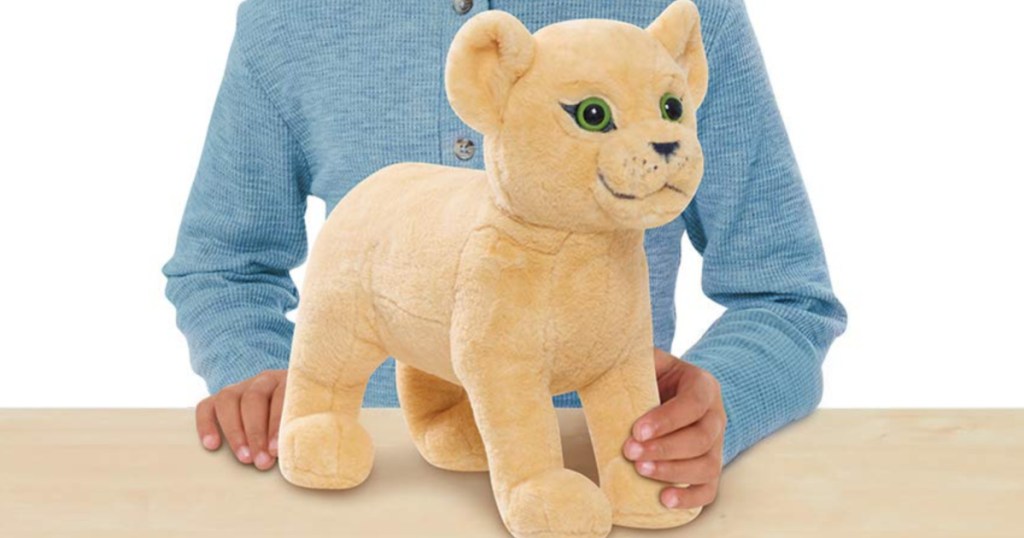 Child Holding Disney Nala Stuffed Animal 