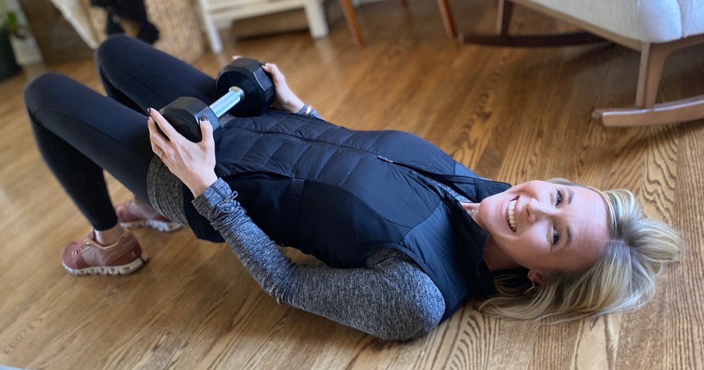 Woman on floor doing glute bridges