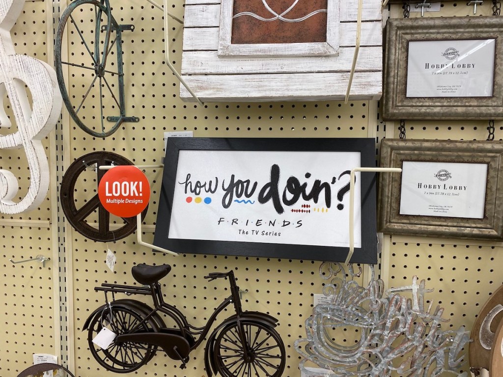 wall of decor at hobby lobby including friends how you doin
